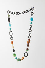 Carica l'immagine nel visualizzatore di Gallery, Collana in corno nero, turchese tibetano, crisoprasio, ambra, citrino e pietra lavica
